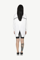 button through step hem shirt white with black details and black short worn by model back view