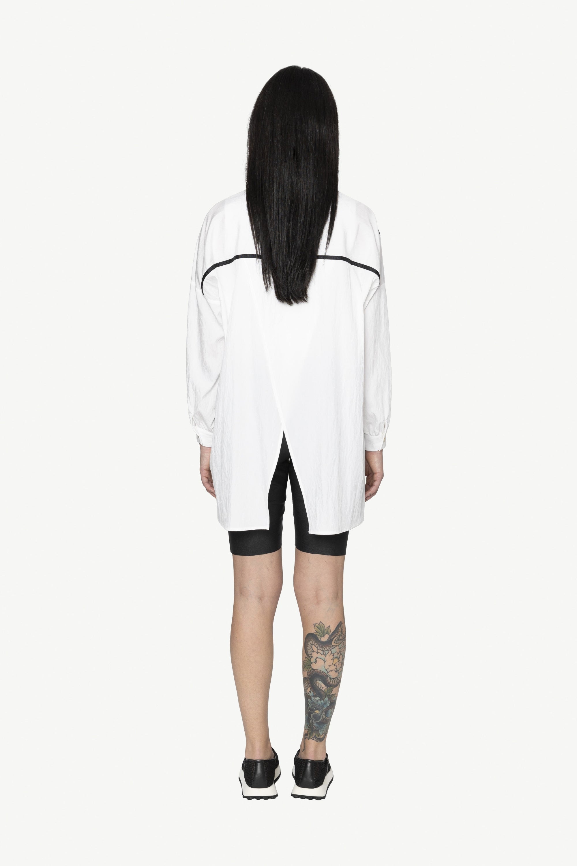 button through step hem shirt white with black details and black short worn by model back view