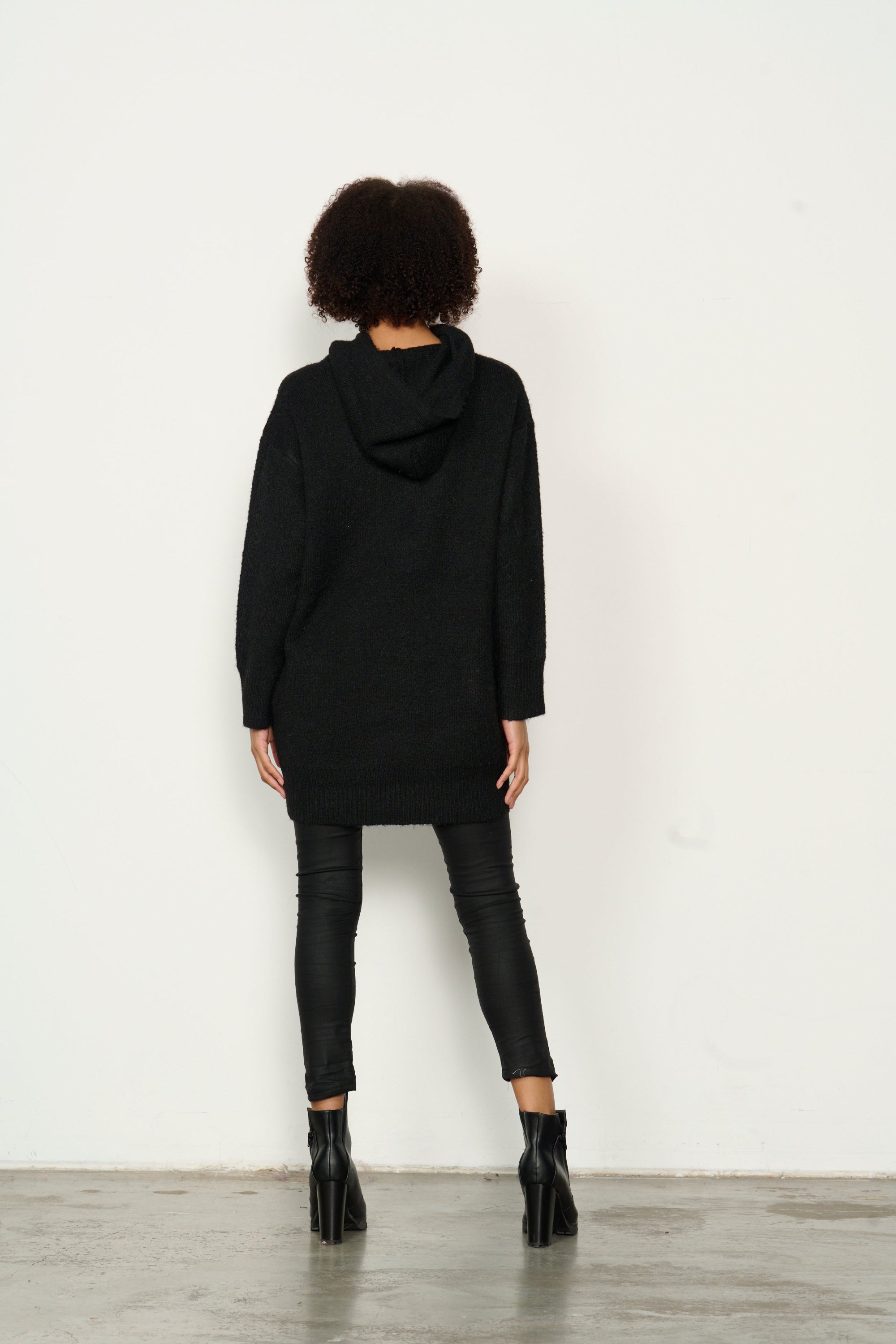 womens longline long sleeve hoodie in black worn by model back view
