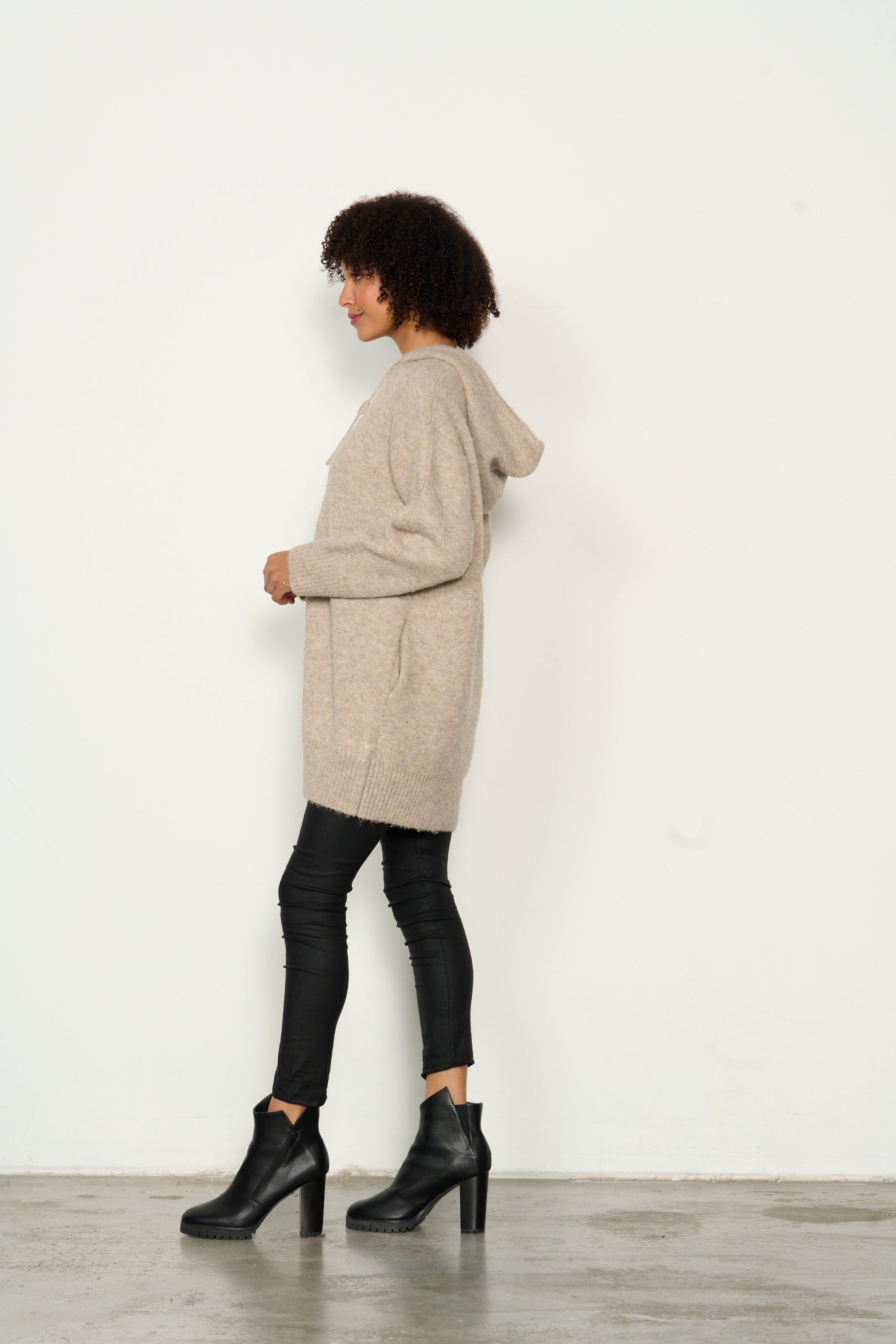 womens longline long sleeve hoodie in oat worn by model side view