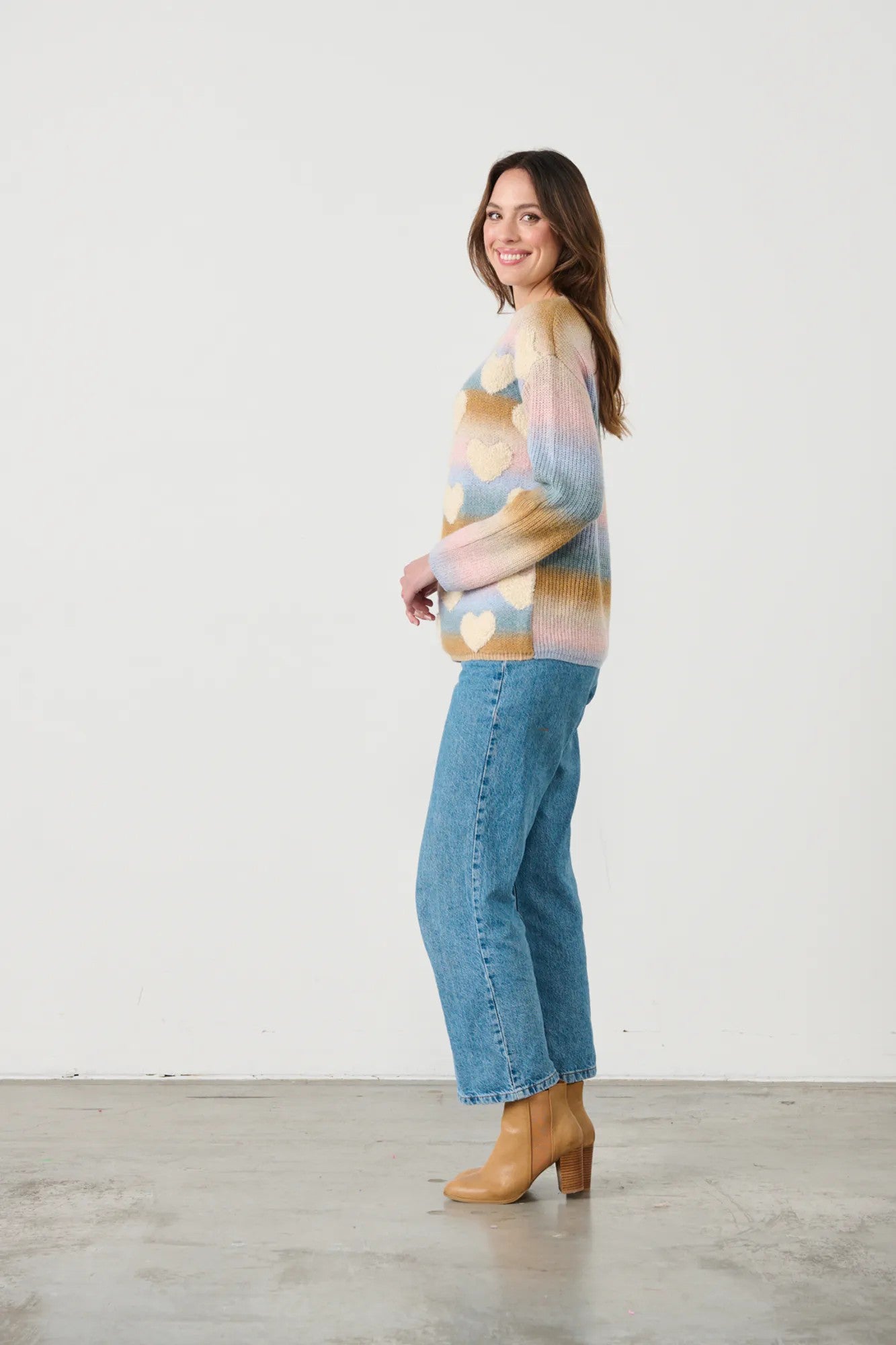 womens crew sweater pastel colours with hearts worn by model side view