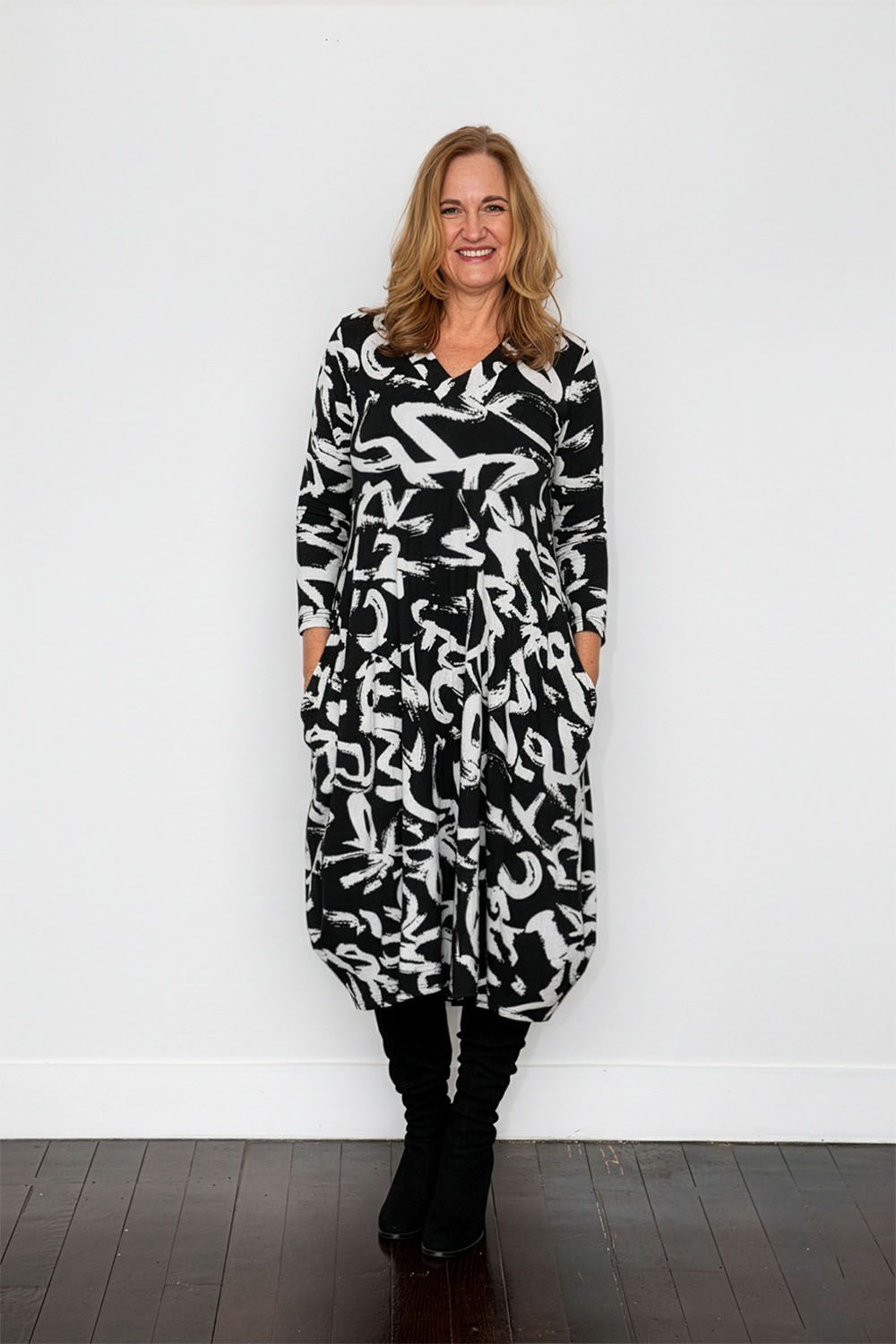 black and white garfitti print midi dress worn by model 