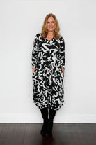 black and white garfitti print midi dress worn by model 