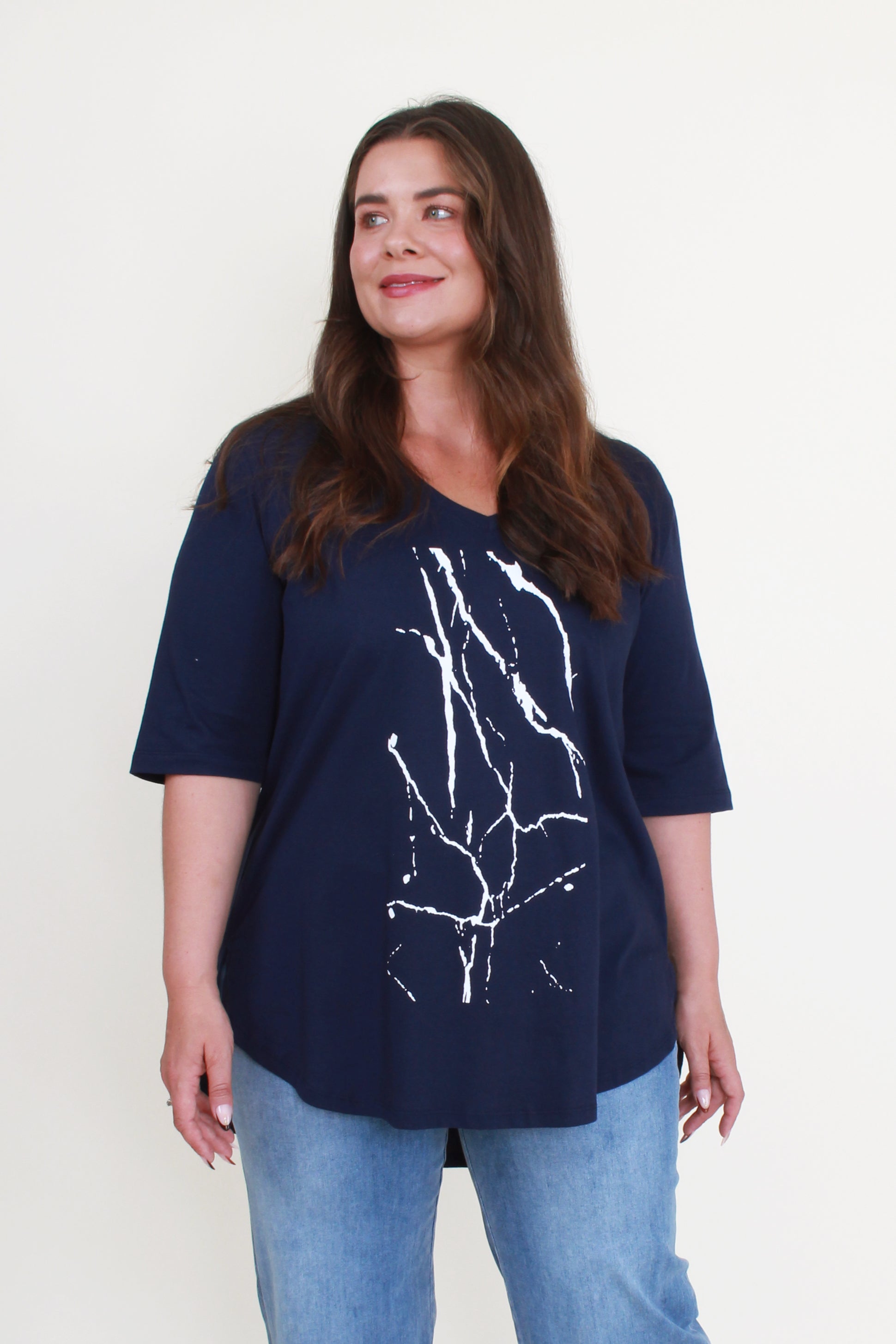 navy tee with white graphic worn by model 