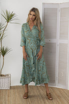 midi wrap dress green botanical print worn by model 