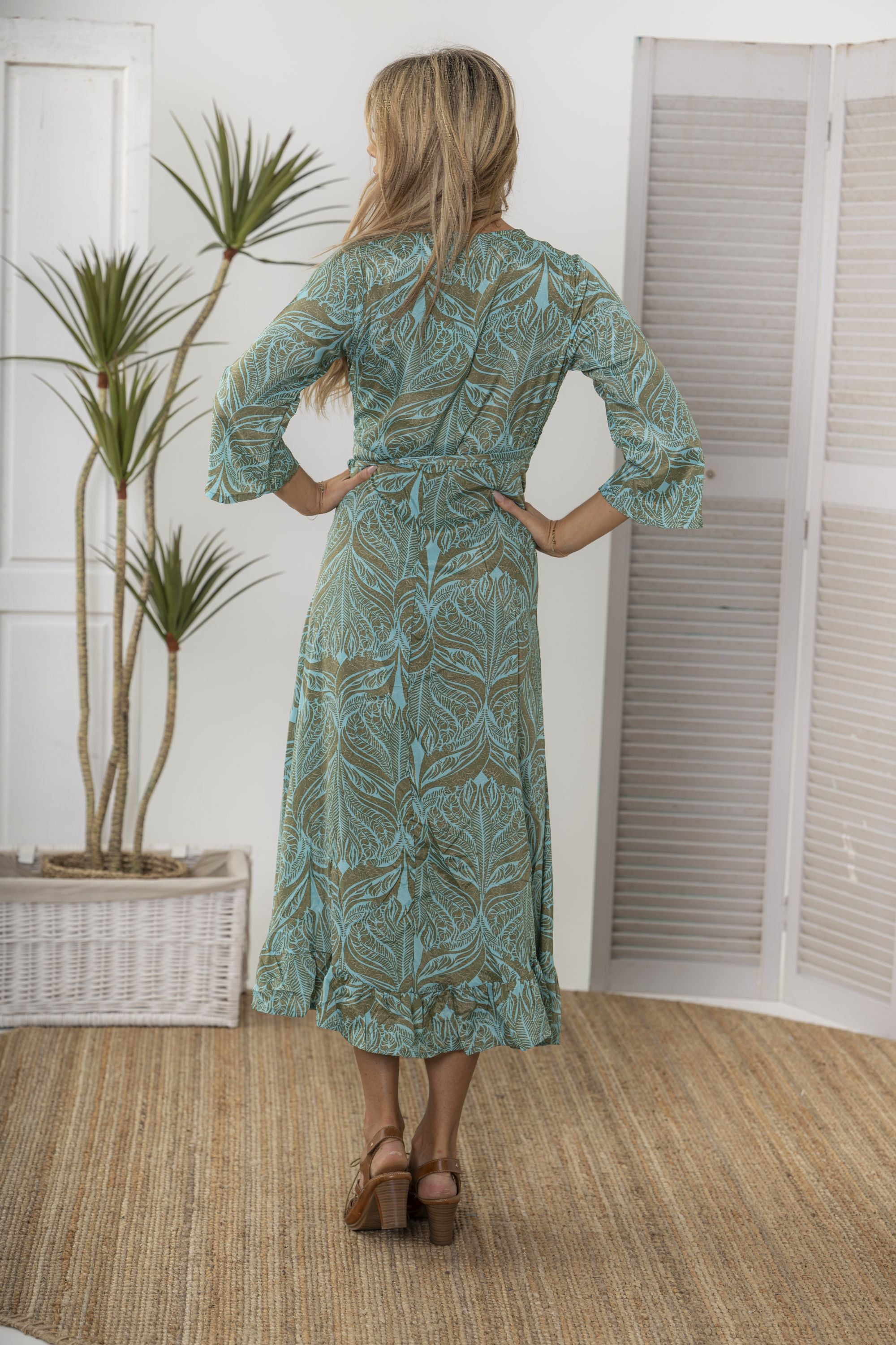 midi wrap dress green botanical print worn by model back view