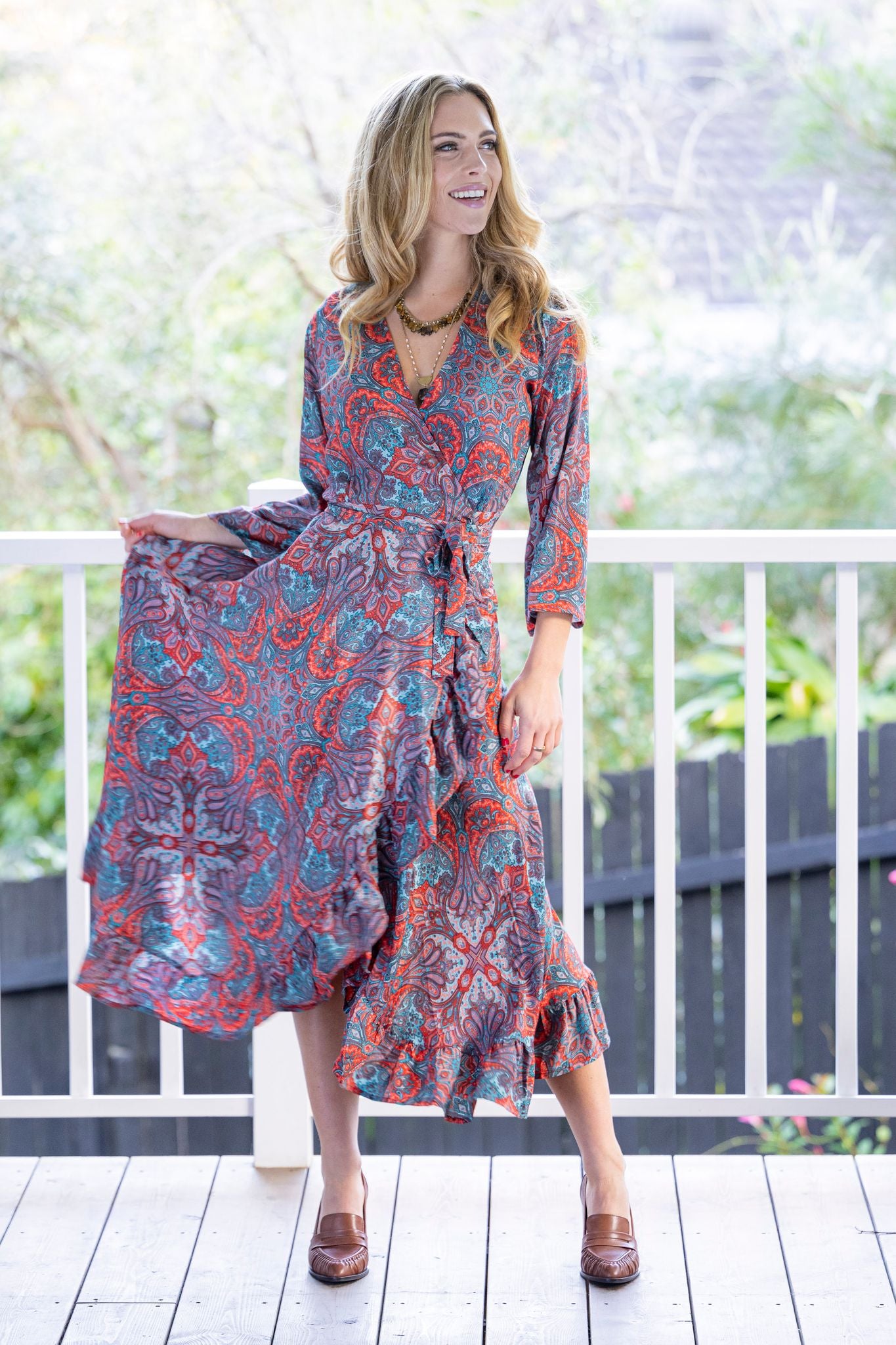 long wrap dress red blue paisley print worn by model