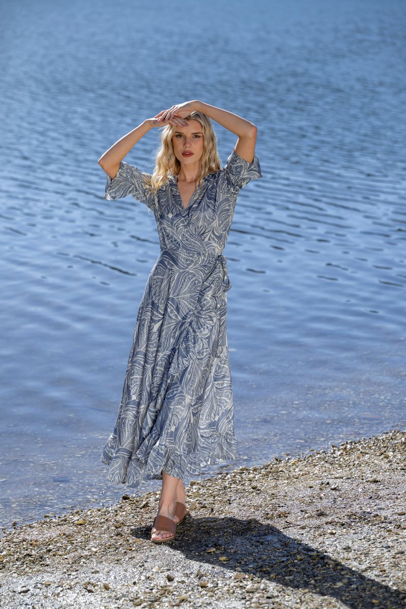 midi wrap dress blue cream print worn by model with lake background