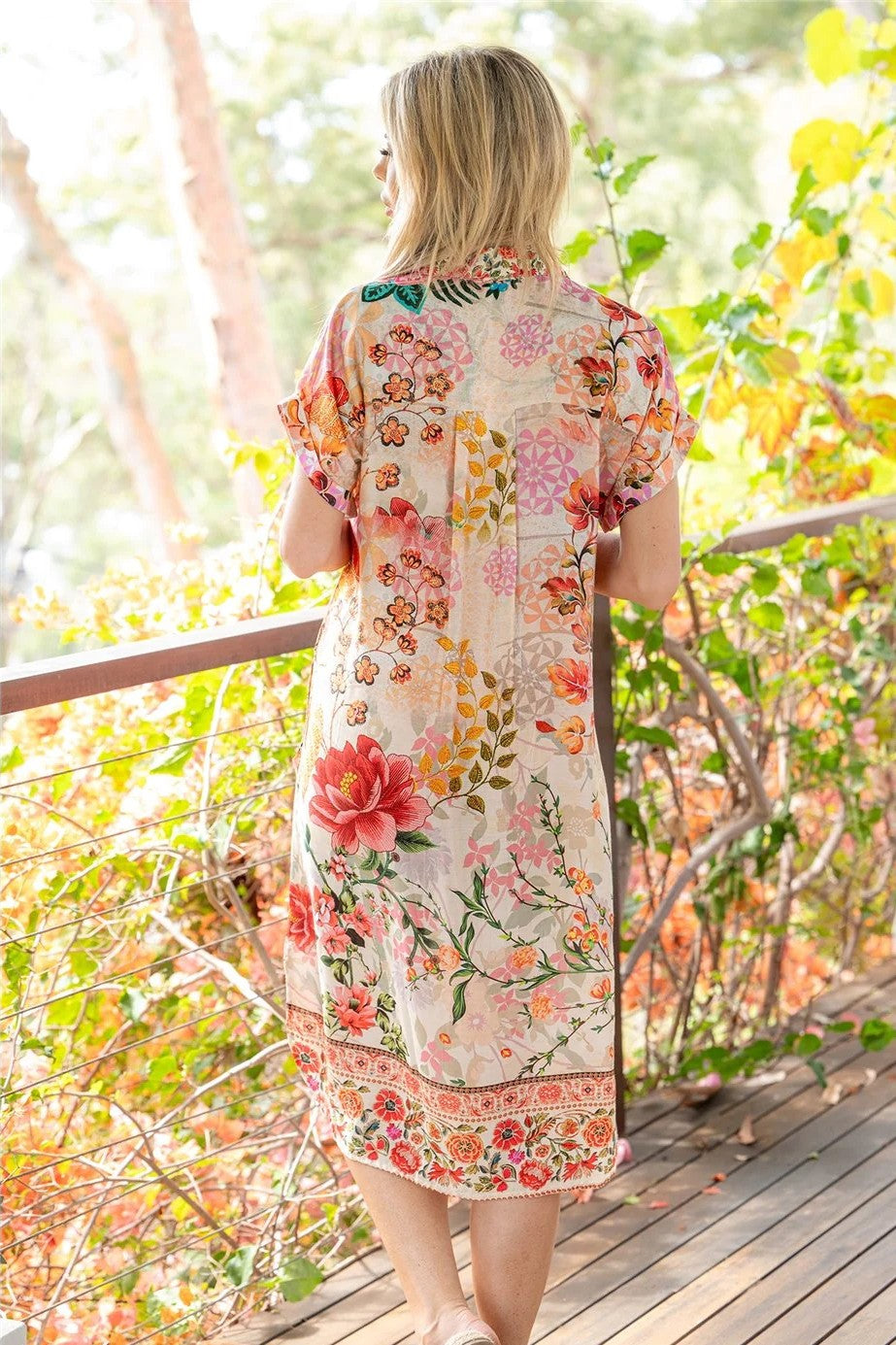 blush white floral dress worn by model outdoors back