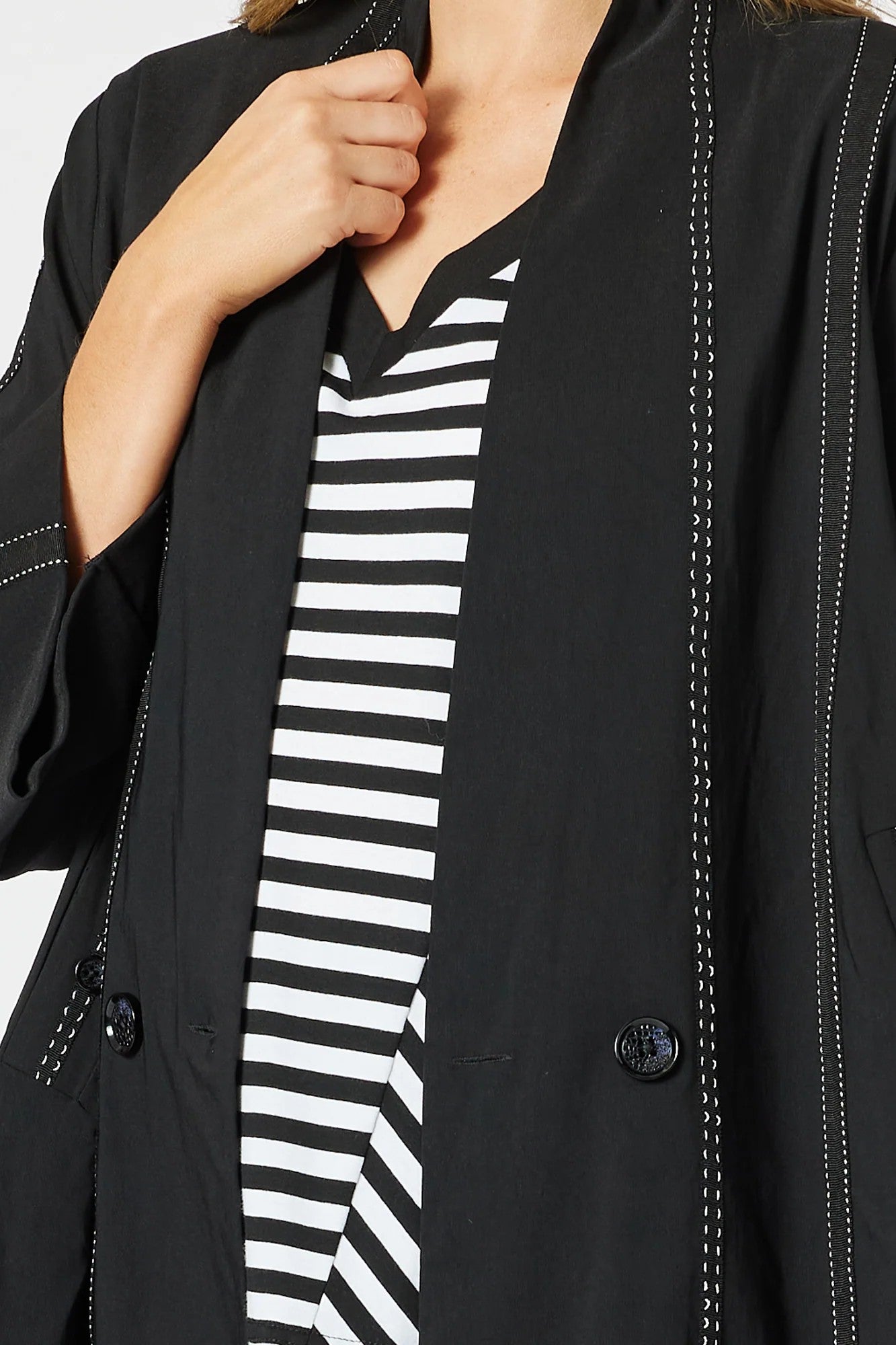 womens black jacket with white stitching details