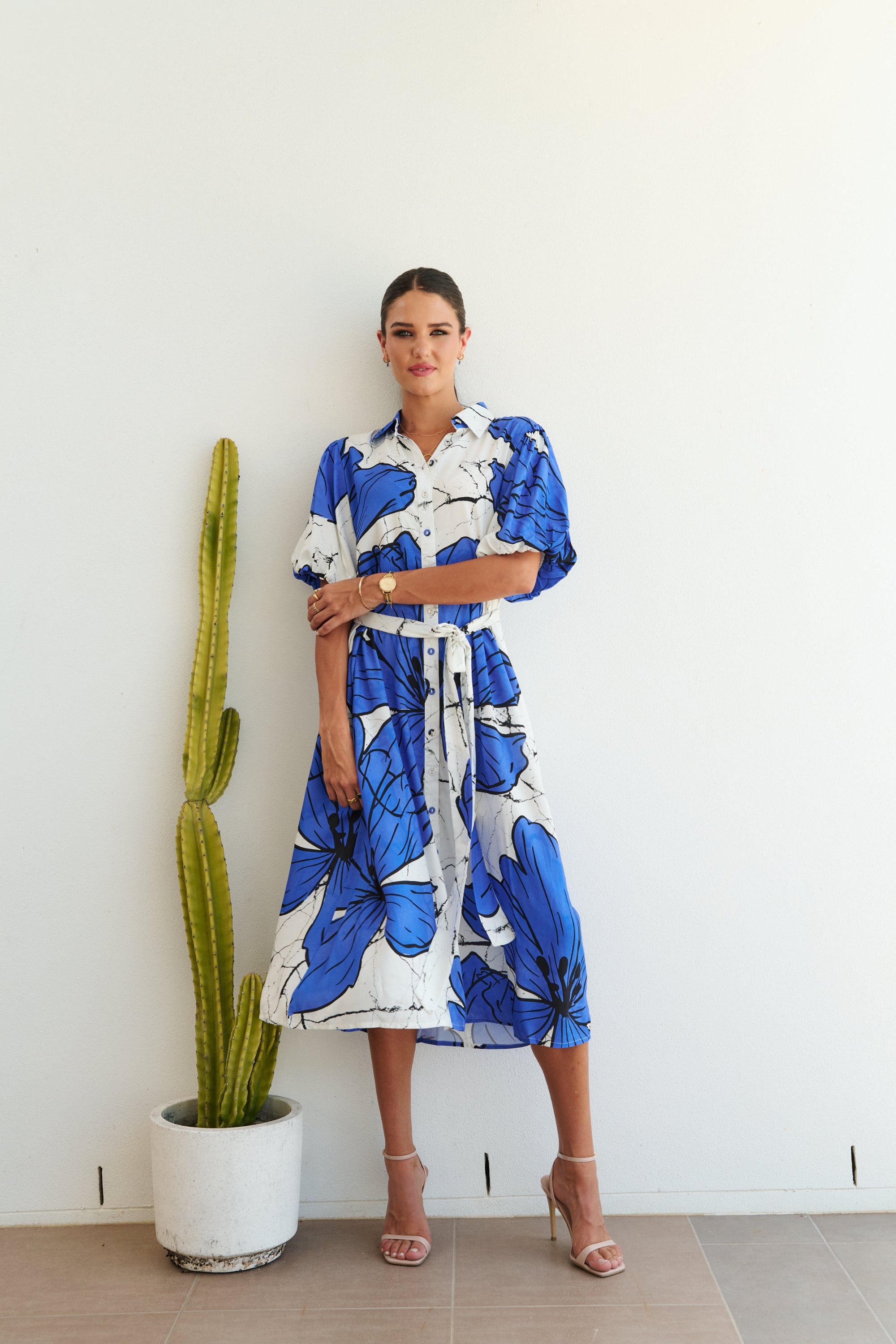 white blue large floral midi dress worn by model 