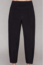 Black cropped pants with a wide waistband, modeled with black strappy high-heeled sandals against a solid gray background.