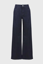 Navy blue wide-leg jeans on a light gray background