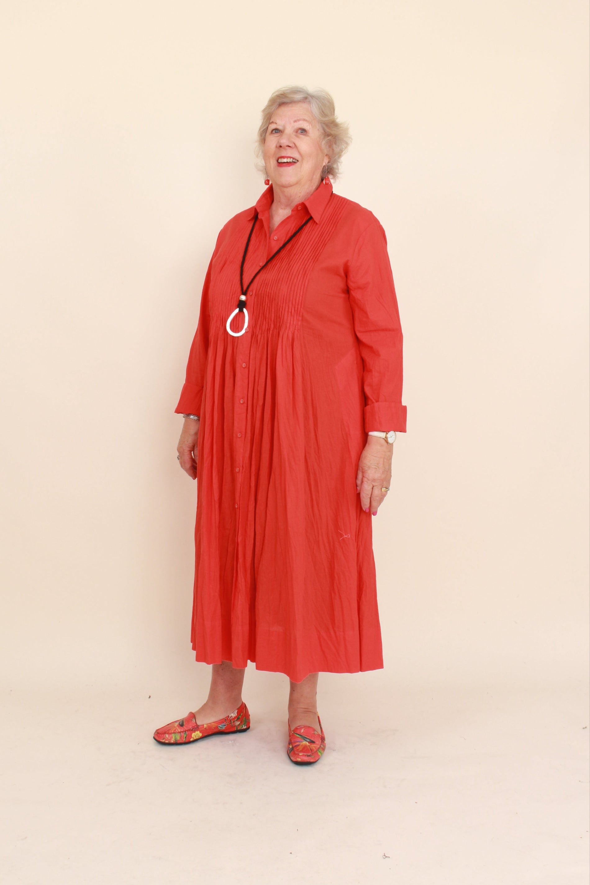 women wearing red dress on plain background