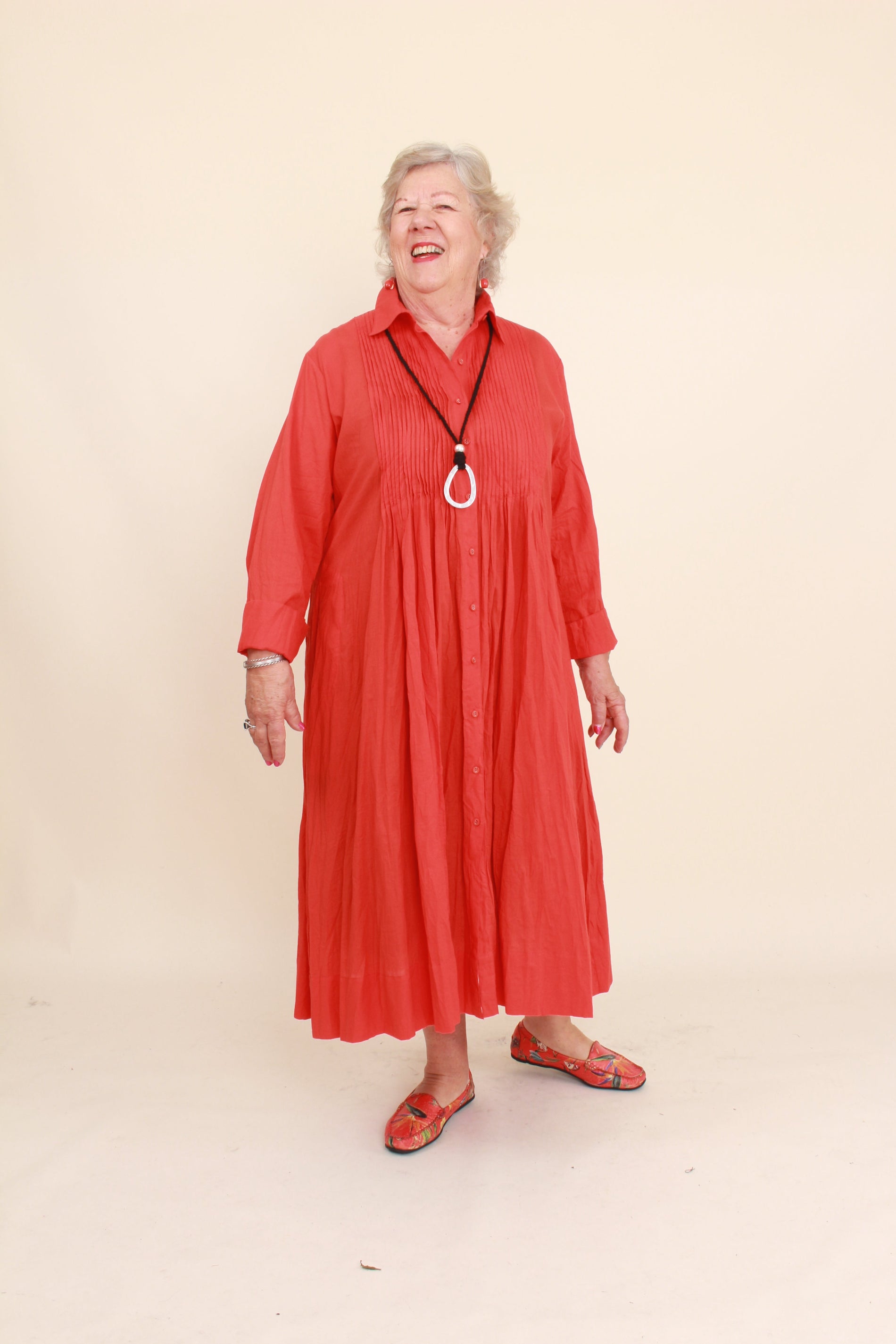 women wearing a red dress on a plain background