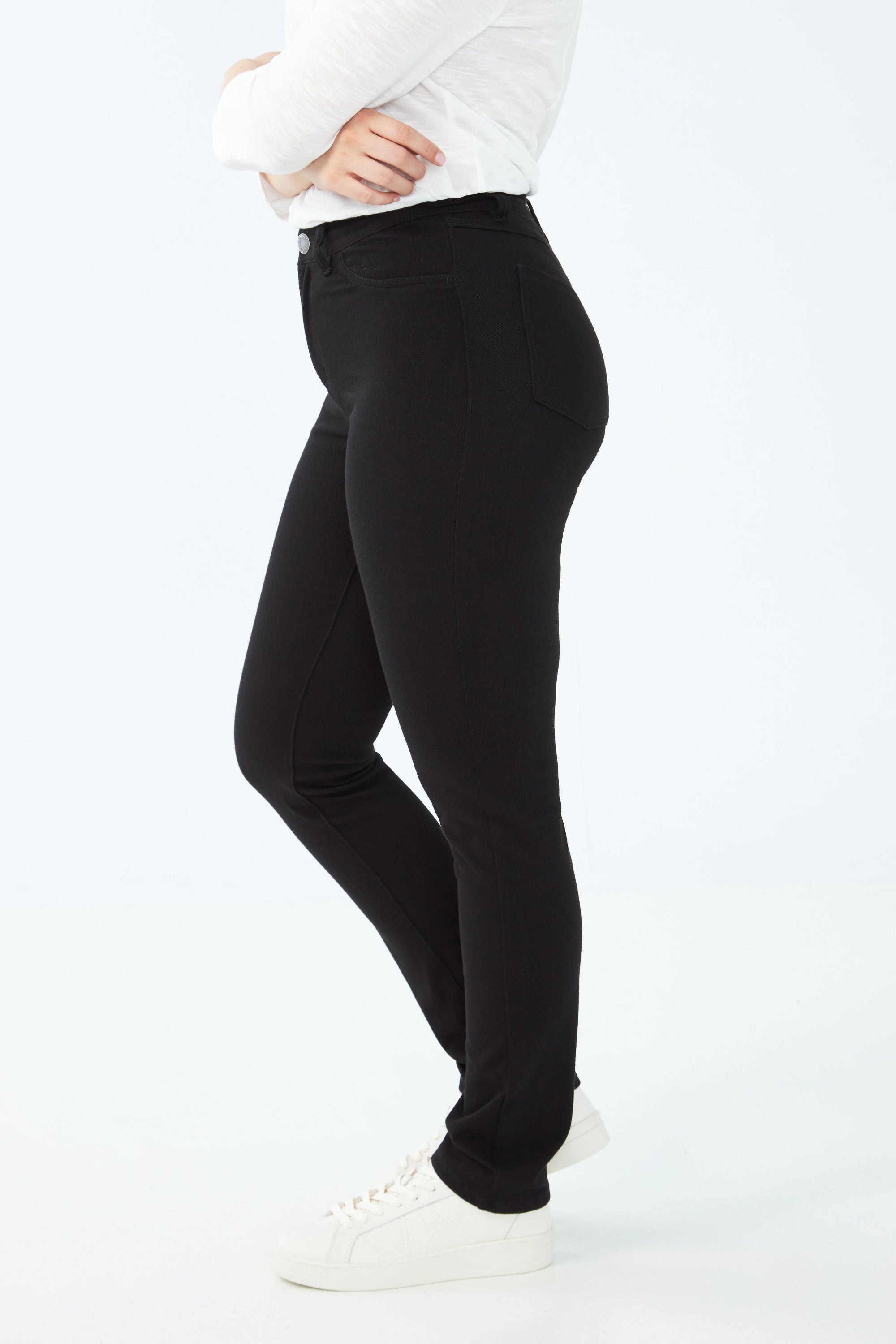 black slim jean worn by model side view