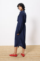 navy blue satin button through midi dress worn by model back