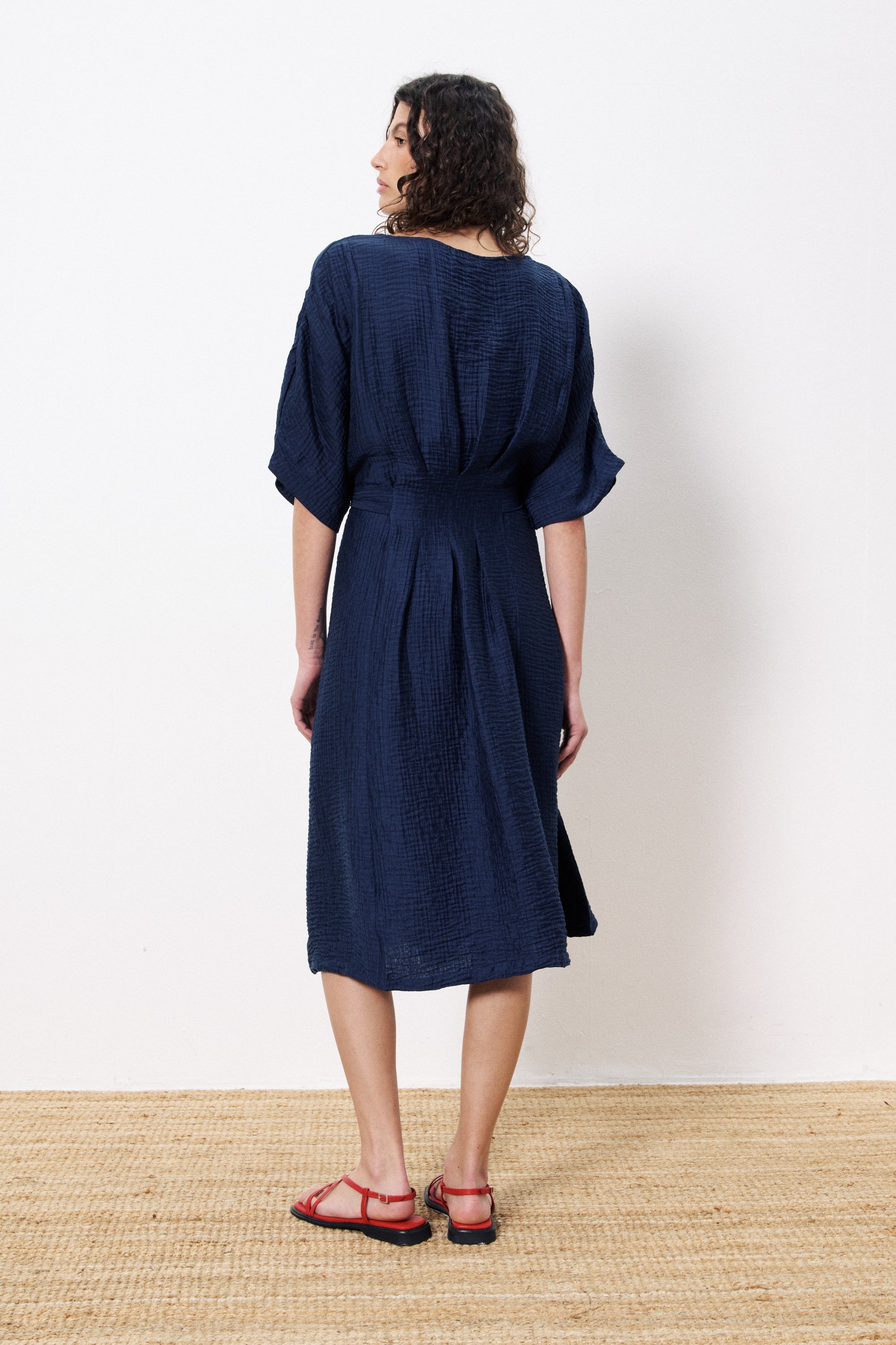 navy midi dress tie waist worn by model back view