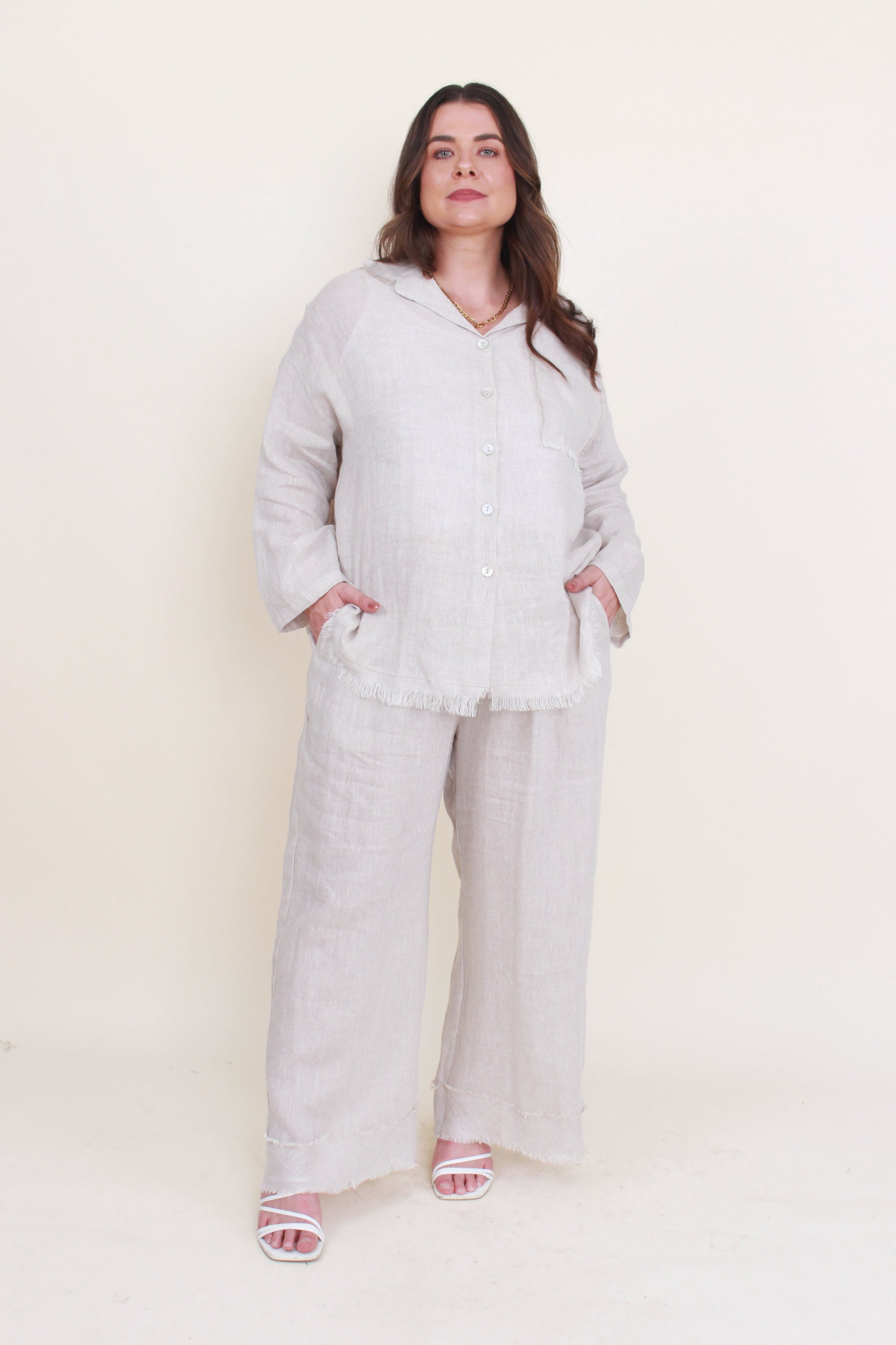 womens button through shirt with fray hems in sand worn by model 