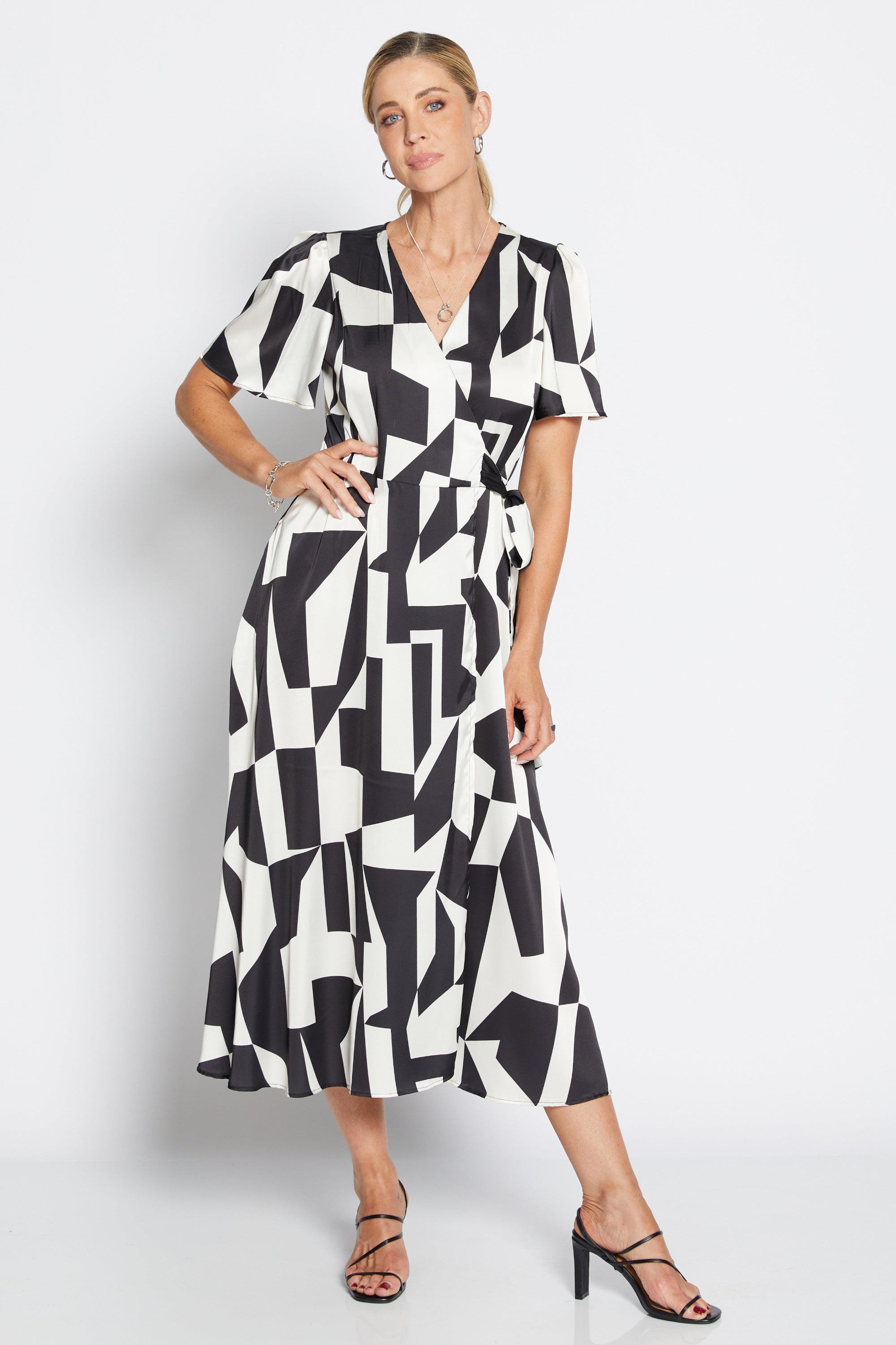 womens wrap midi dress black white geometric print worn by model