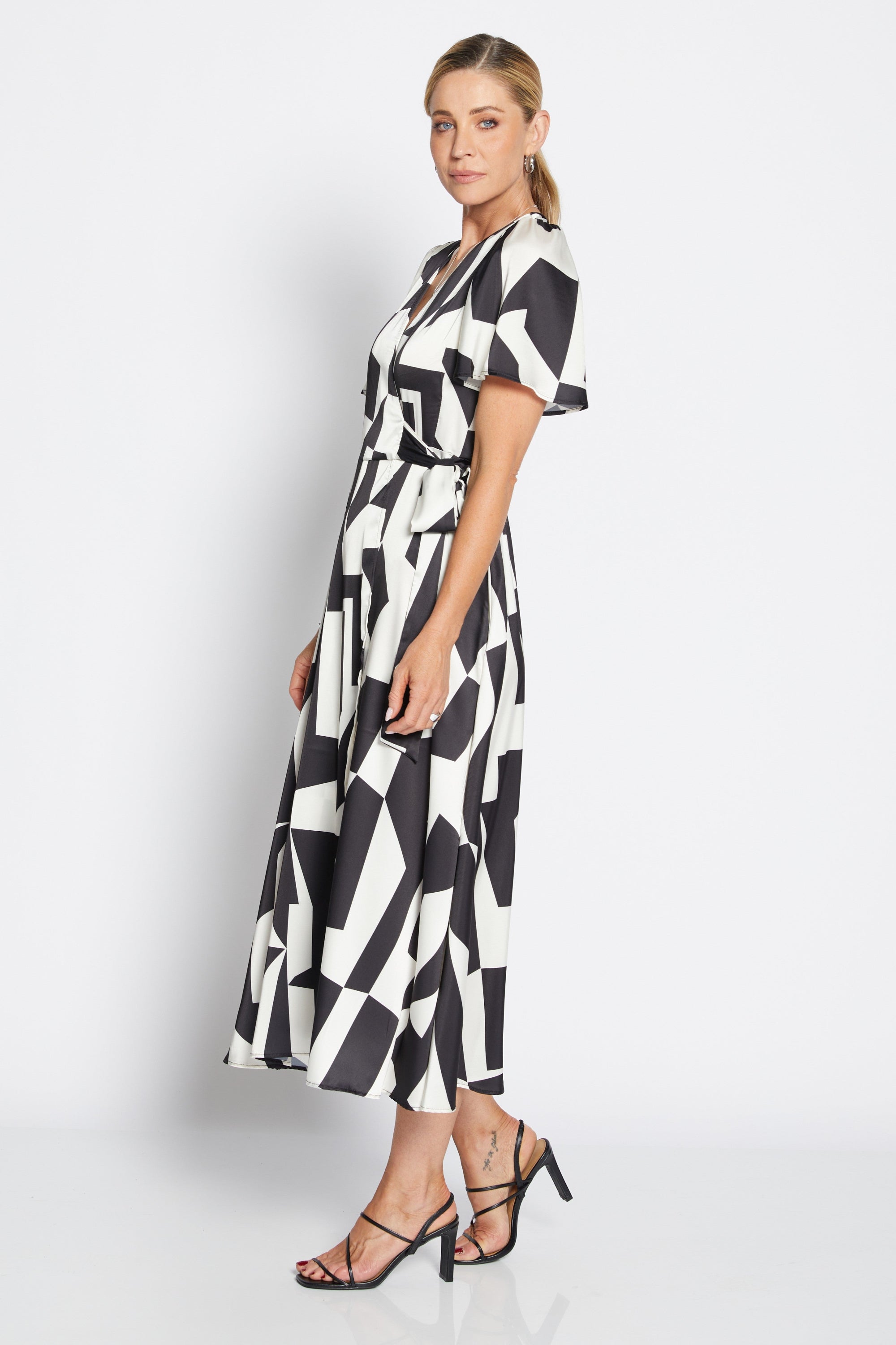 womens wrap midi dress black white geometric print worn by model side view