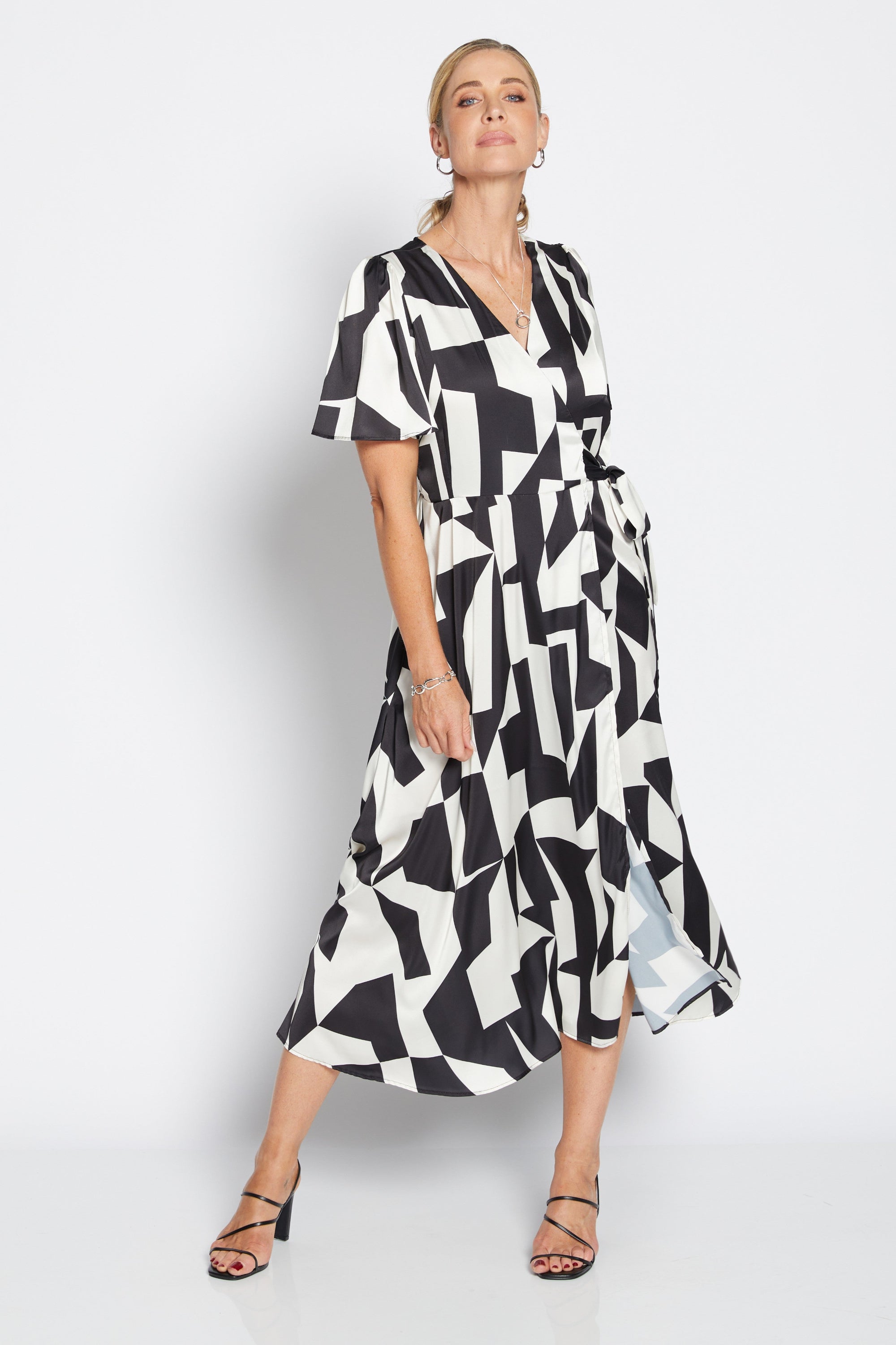 womens wrap midi dress black white geometric print worn by model