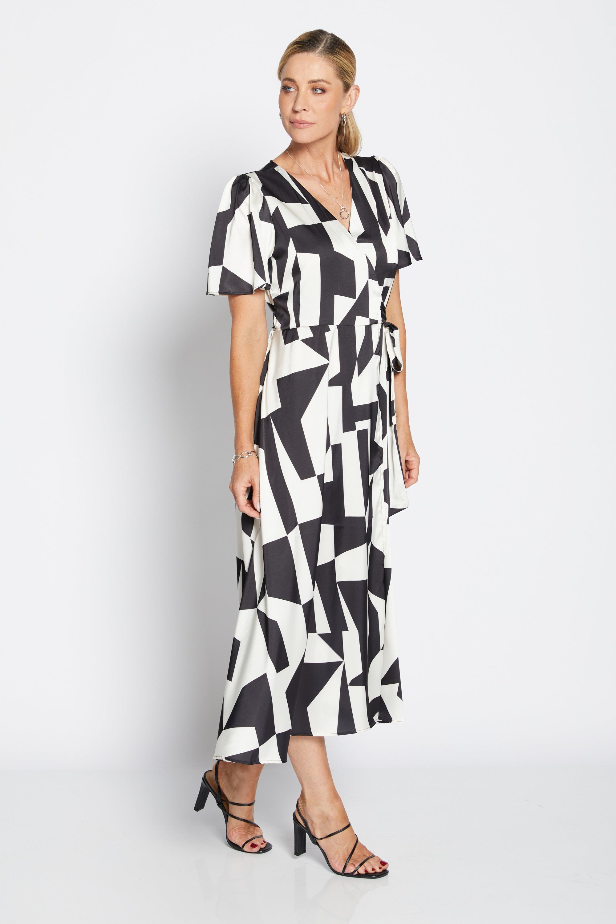 womens wrap midi dress black white geometric print worn by model