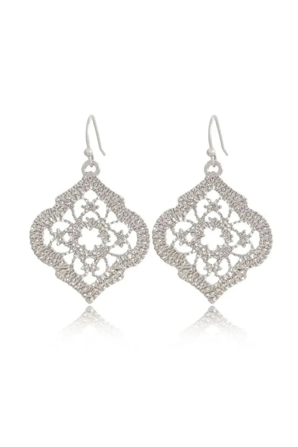 silver earrings with moroccon design clear cut white background