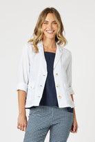 boxy linen blazer in white worn by model 
