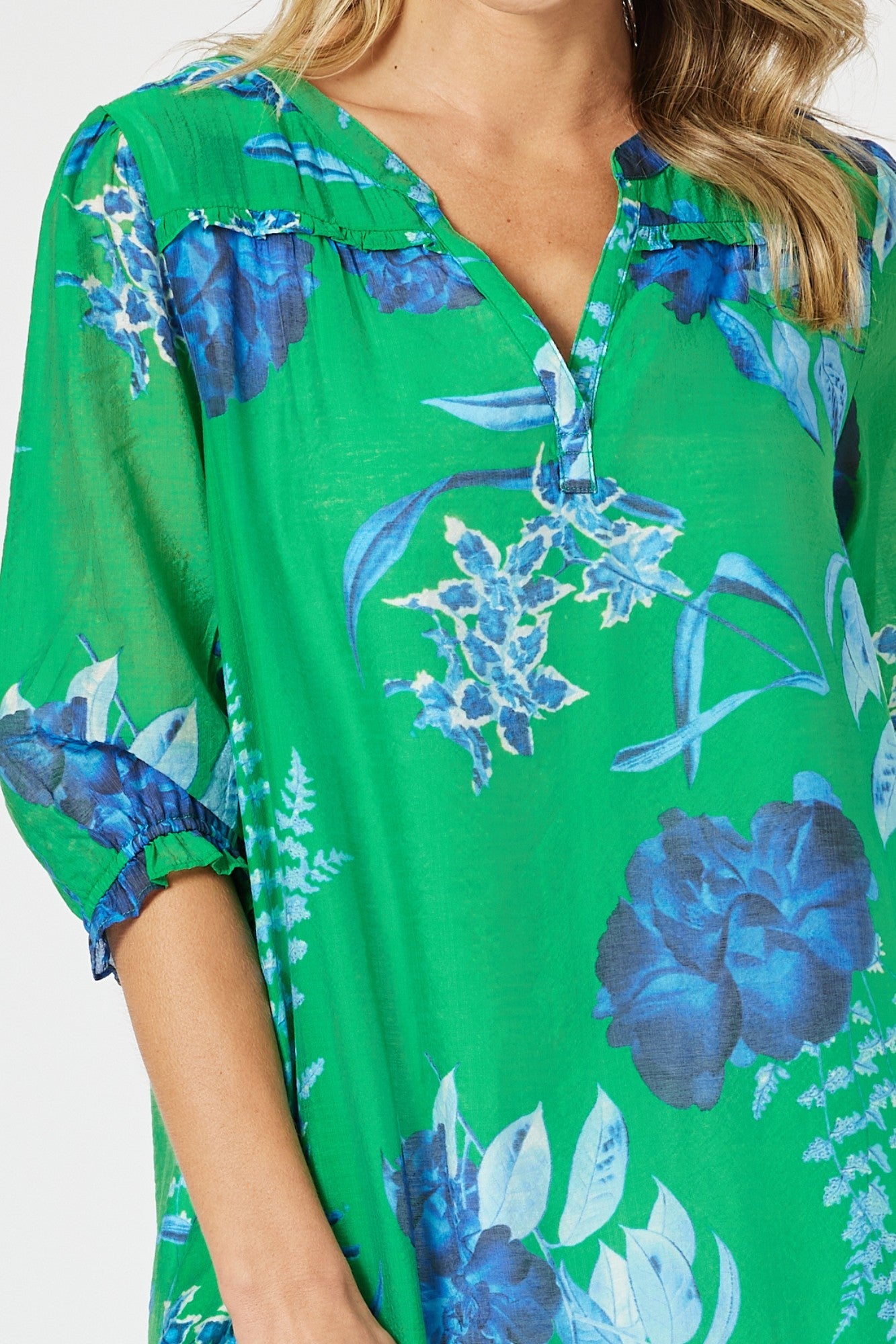 womens midi dress with soft pleating v neckline in green and blue floral print top detail