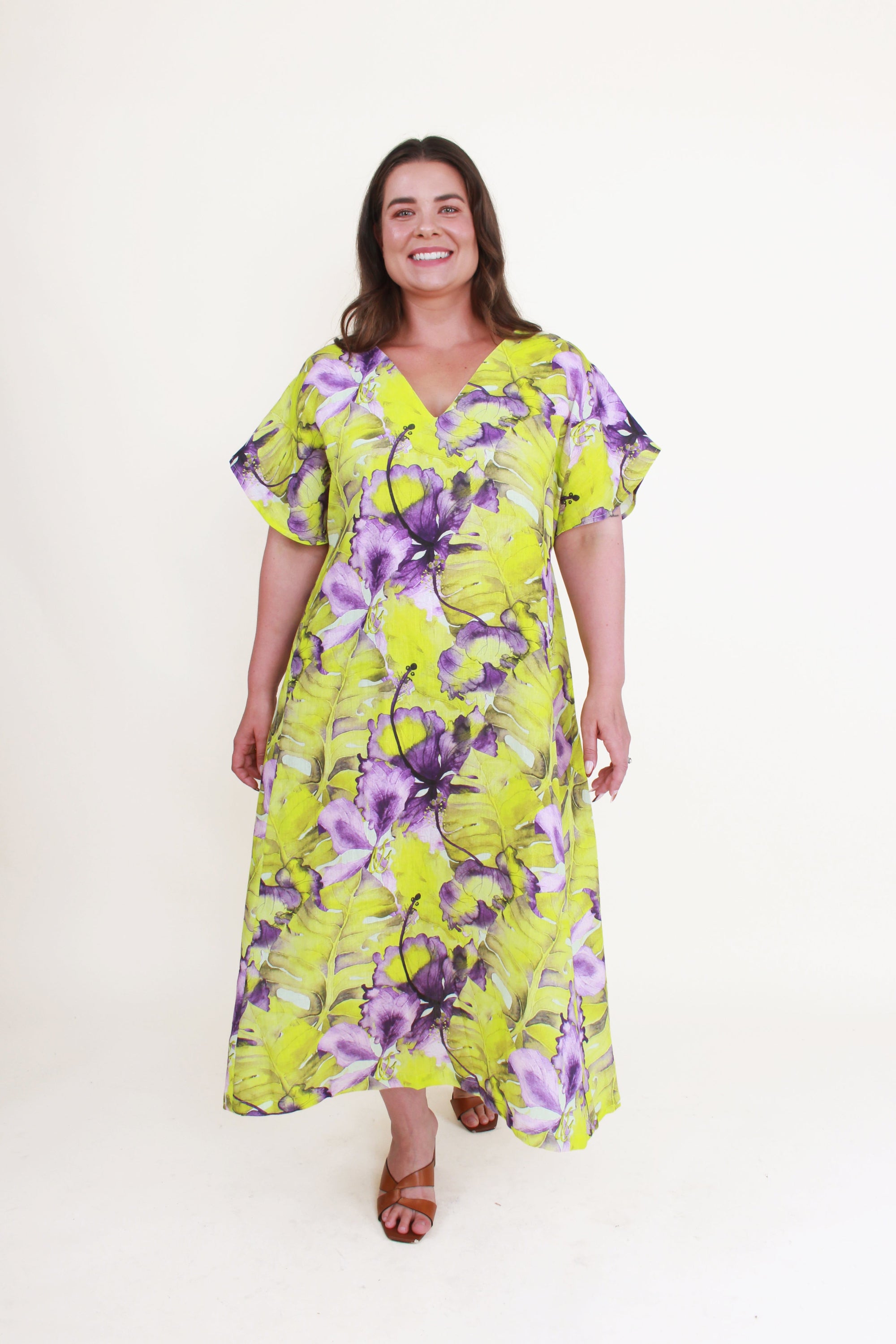 Woman wearing a floral dress with a white background