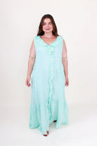 Woman wearing a light blue dress on a white background
