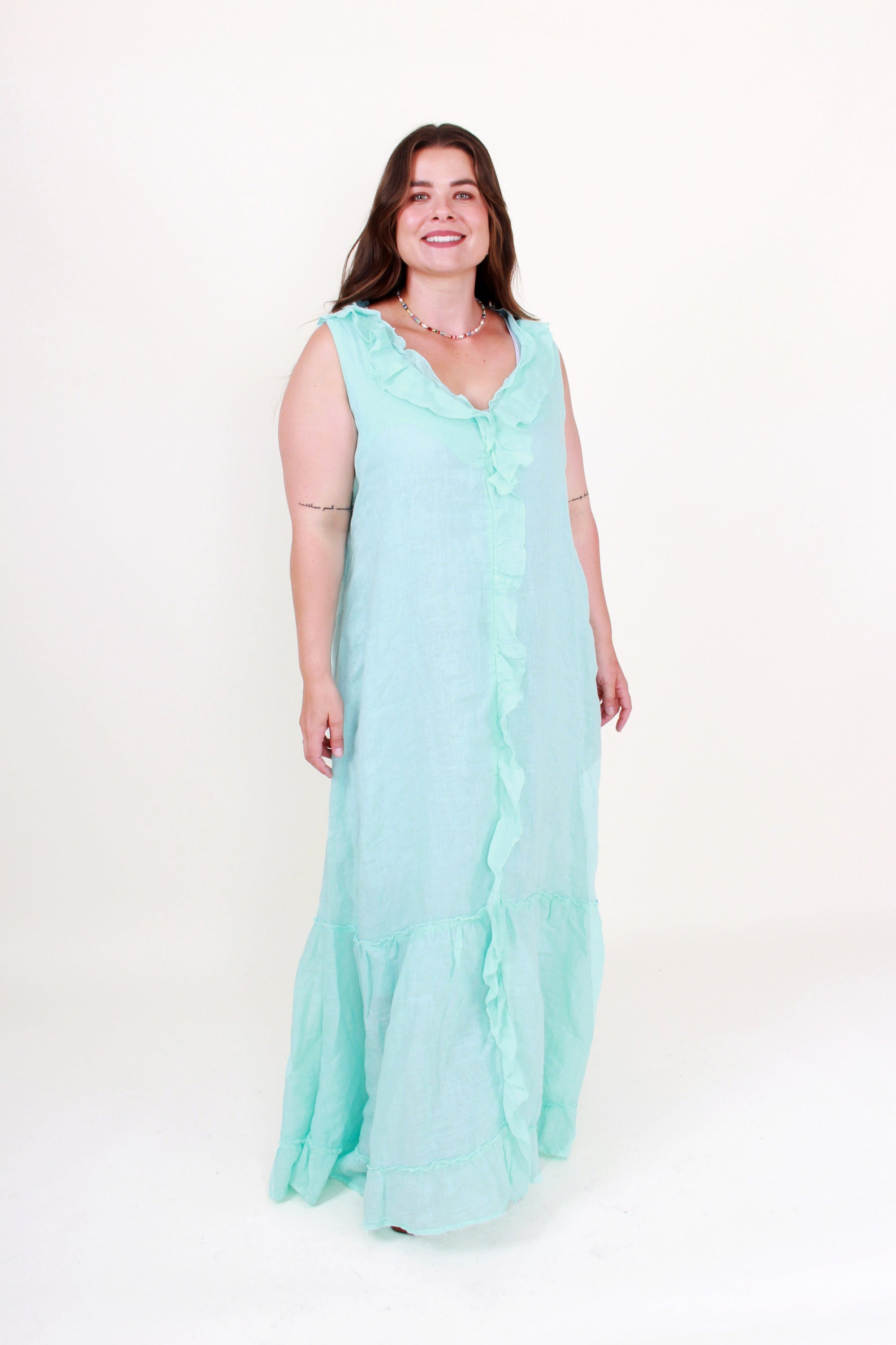 Woman wearing a light blue dress on a white background