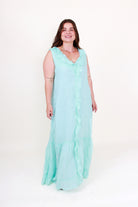 Woman wearing a light blue dress on a white background