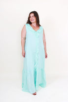 Woman wearing a light blue dress on a white background