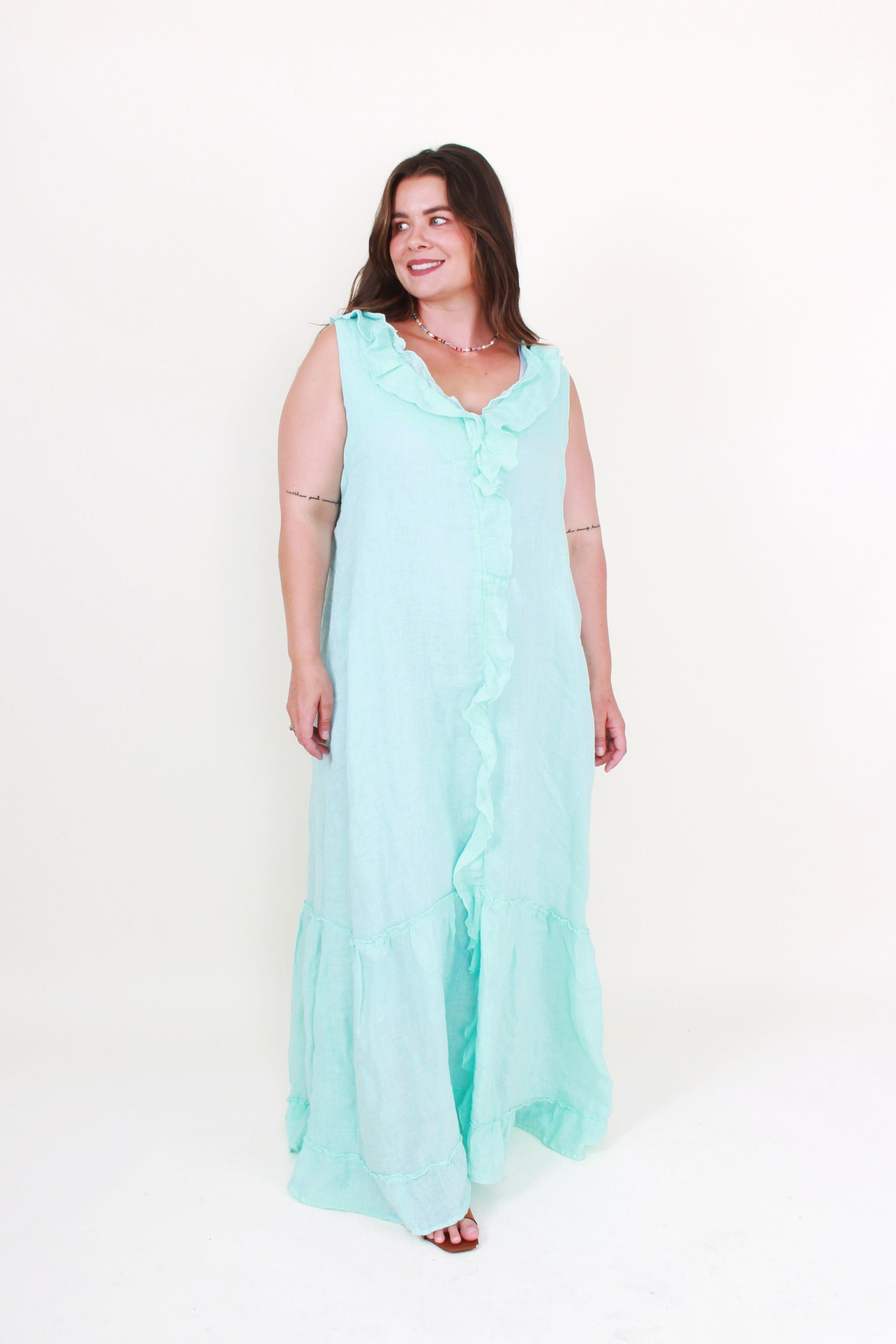 Woman wearing a light blue dress on a white background