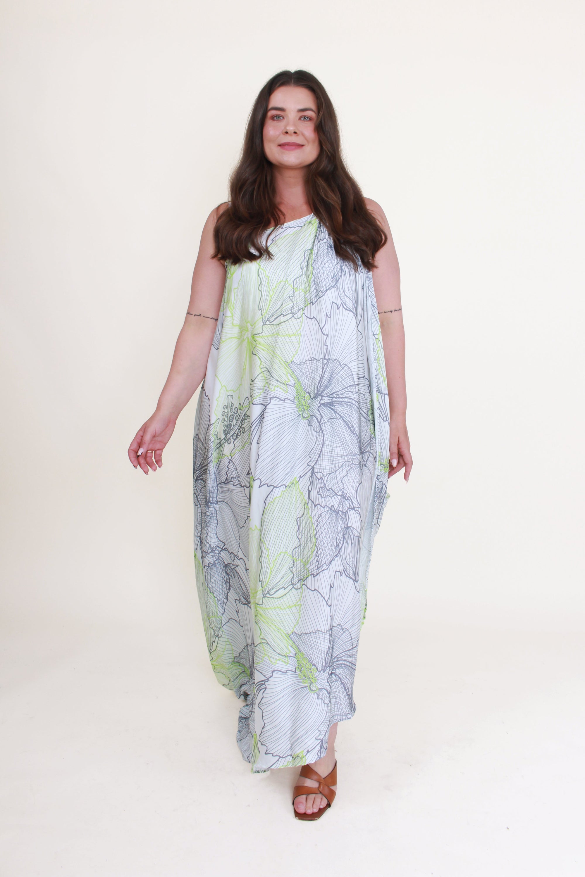 Woman wearing a floral dress on a white background