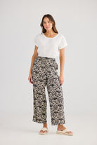 Wide leg pant cream and black fan print and white tee worn by model 