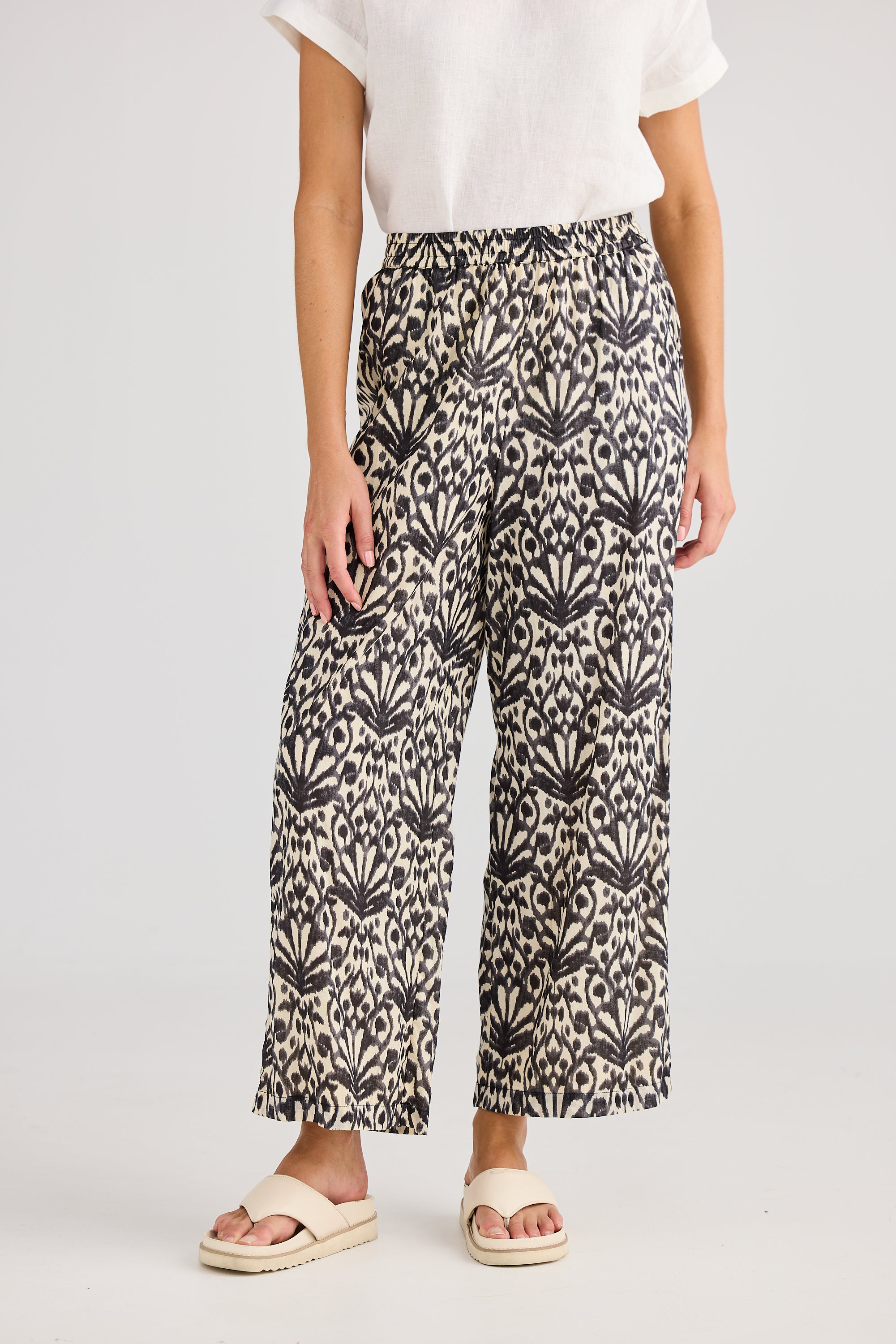 Wide leg pant cream and black fan print worn by model 