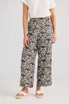 Wide leg pant cream and black fan print worn by model 