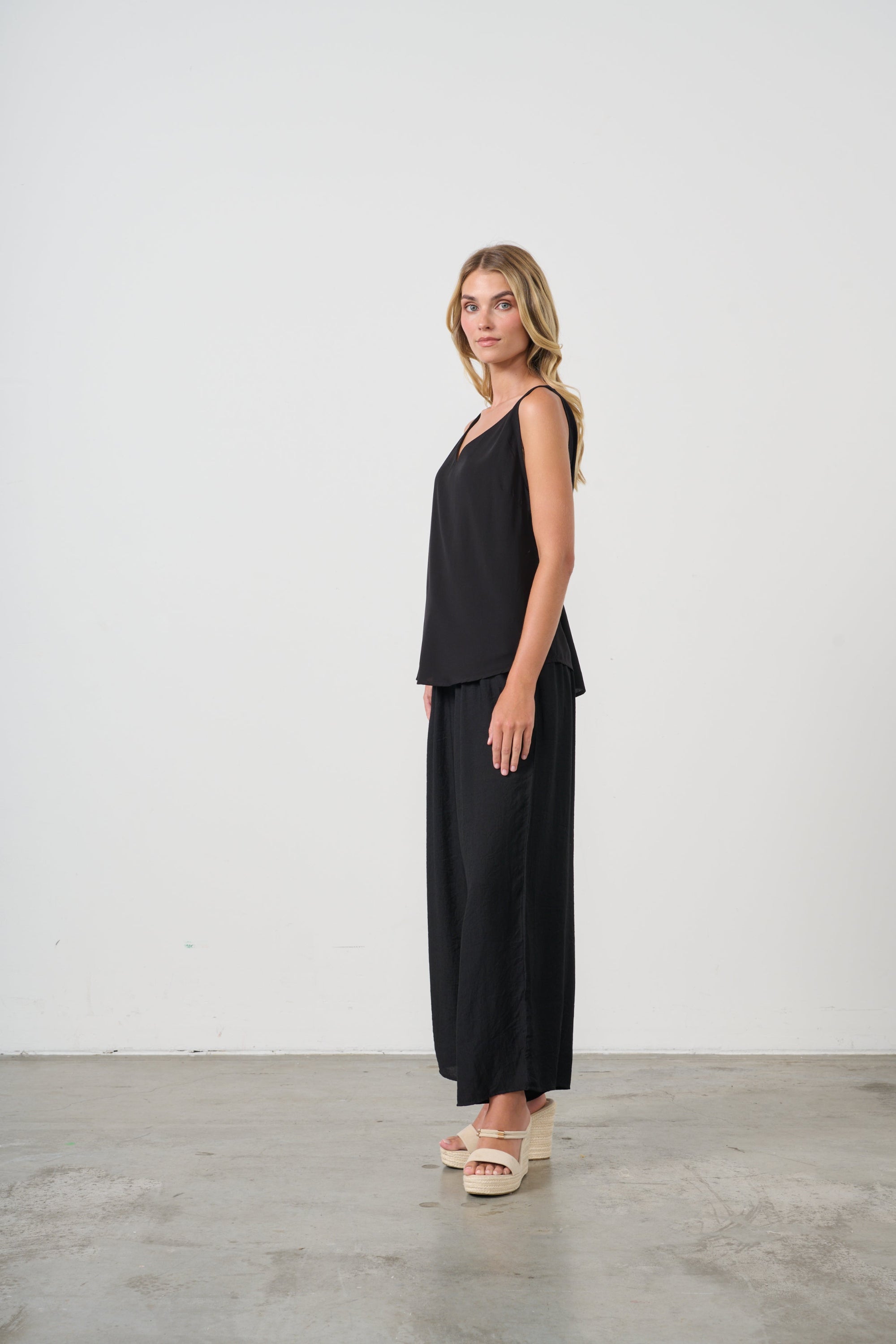 womens wide leg black pants with drawstring worn by model side view