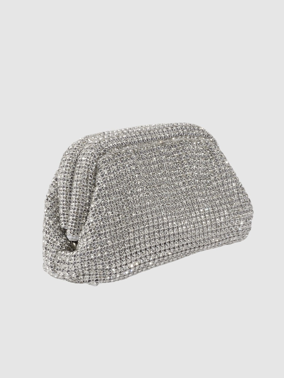 Silver clutch bag with rhinestone embellishments on a light gray background