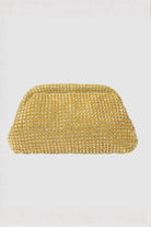 Gold mesh clutch bag on a light gray background