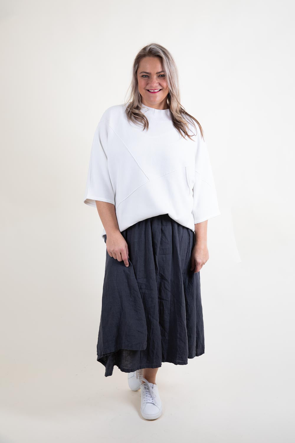 Sweater with skirt outlet panel