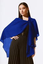 royal blue ciffon cover up worn by model over black outfit