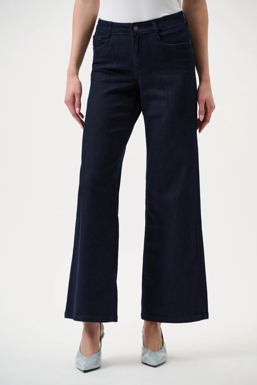 Navy blue wide-leg jeans worn by a person on a white background