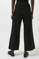 womens wide leg black pant front button pockets worn by model back view
