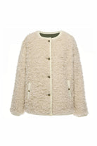 cream shearling jacket on white background
