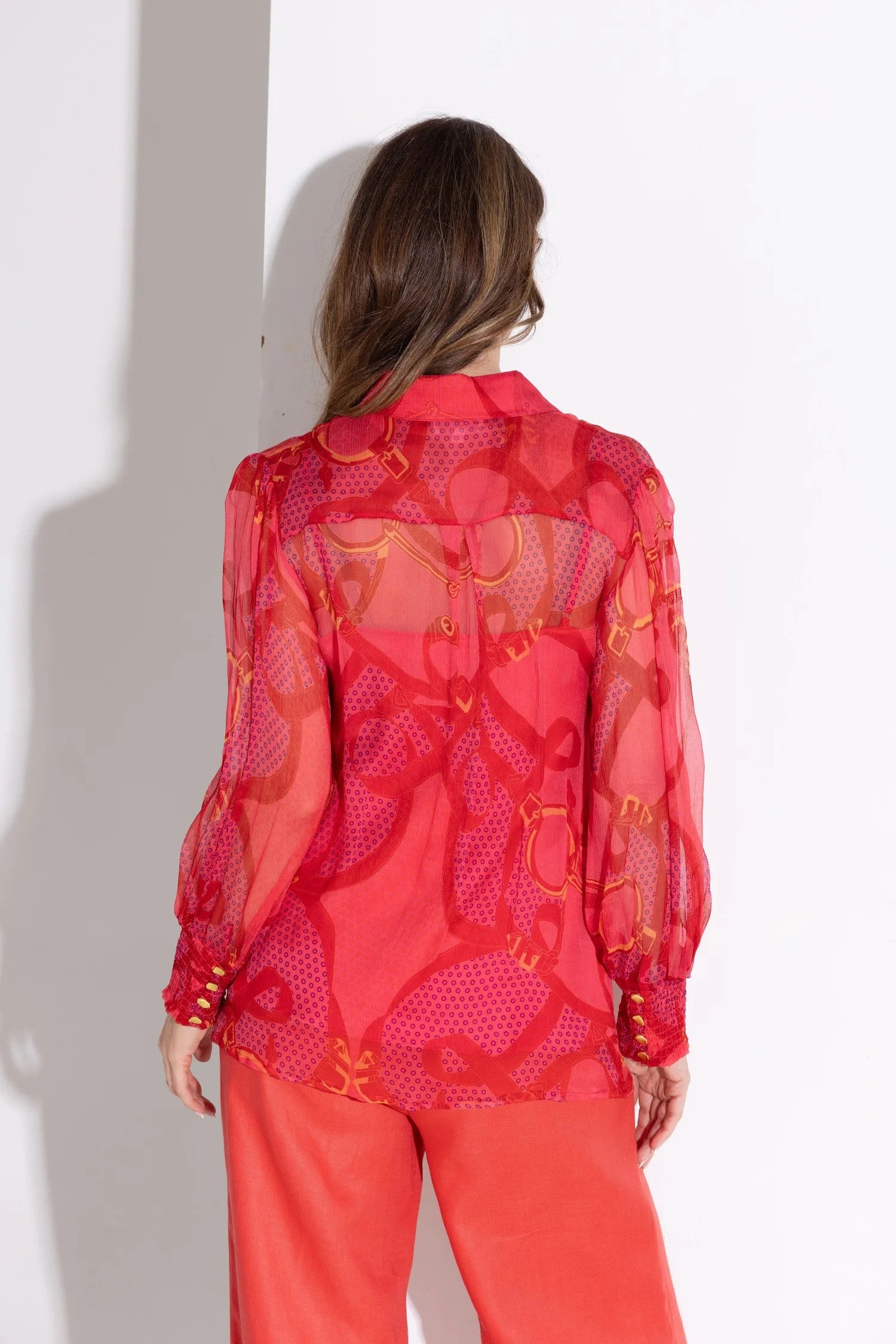 printed reds silk blouse and red pant worn by model back view