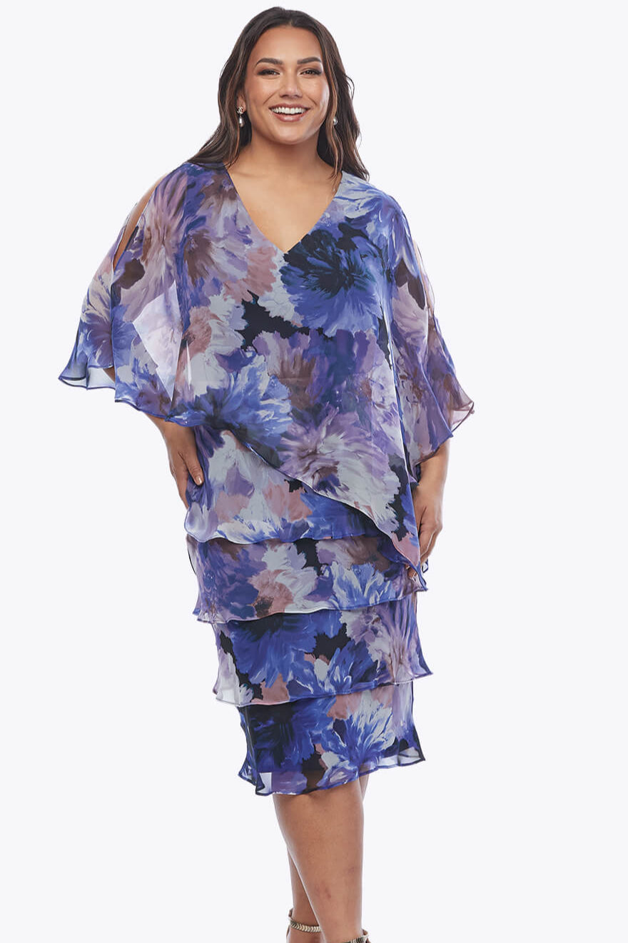 Woman wearing a floral dress on a white background